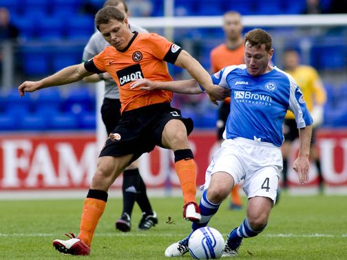 John Rankin and Patrick Cregg do battle for the ball