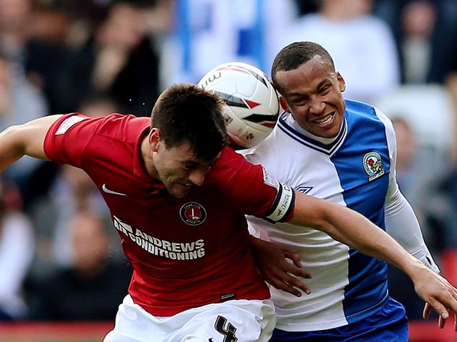 Johnnie Jackson and Martin Olsson battle for the ball