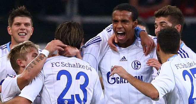 Joel Matip is mobbed after scoring
