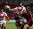 Mark Flanagan of St Helens attempts an offload