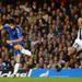 ...he takes a touch to move the ball away from two defenders, switches direction and curls a shot underneith the crossbar.
