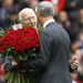 Sir Bobby Charlton presents a boquet of flowers to Ian Rush