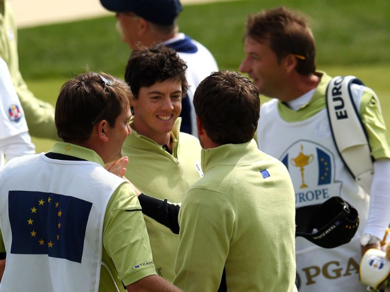 Graeme McDowell and Rory McIlroy celebrate on the 18th green after defeating the team of Furyk/Snedeker to earn Europe their first point