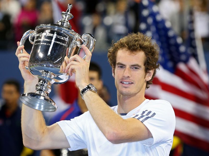 Andy Murray lifts the US Open trophy and becomes the first Briton for 76 years to win a grand slam title.