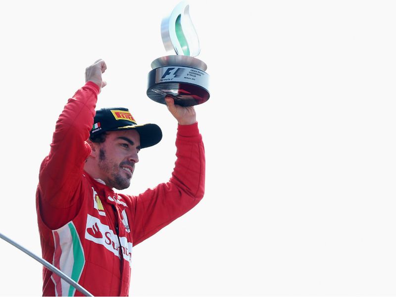 Fernando Alonso celebrates third