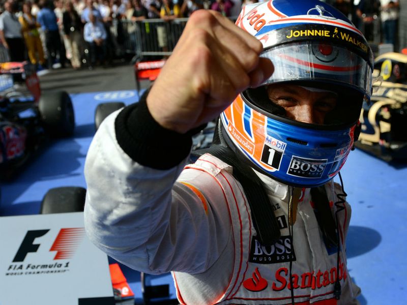 Button celebrates in parc ferme