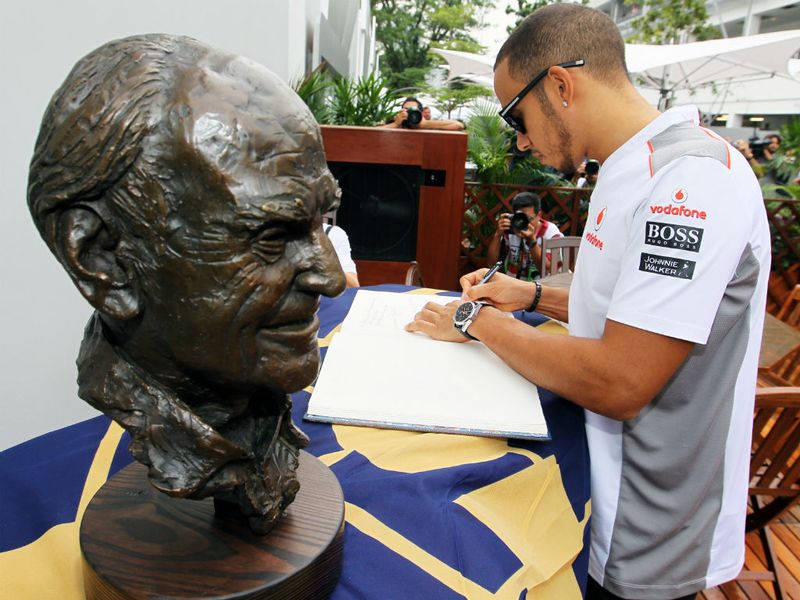 Hamilton signs the book of condolence for Sid Watkins