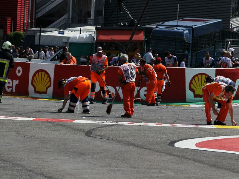 The marshals clear the debris. They are the volunteers who mean we can enjoy motor racing.