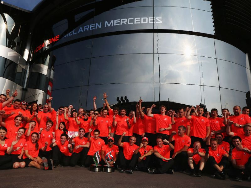 McLaren celebrate with their rocket red t-shirts