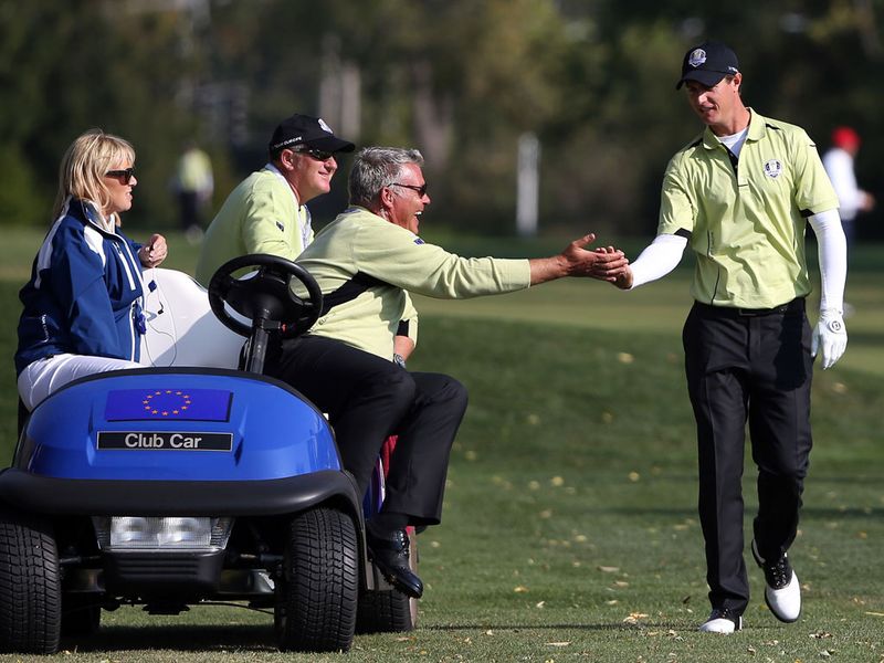 Colsaerts (R) is congratulated by vice-captain Darren Clarke as his performance proved to be a rare highlight for Europe