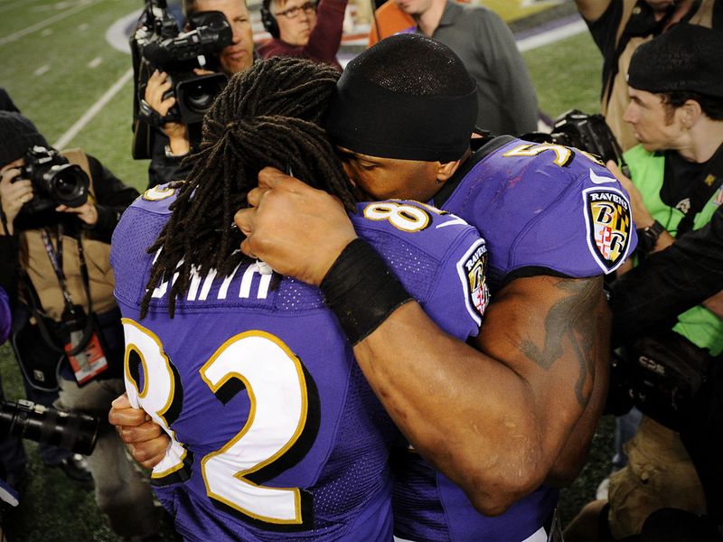 Torrey Smith is embraced by Ray Lewis after inspiring the Ravebs to an emotional win over the Patriots