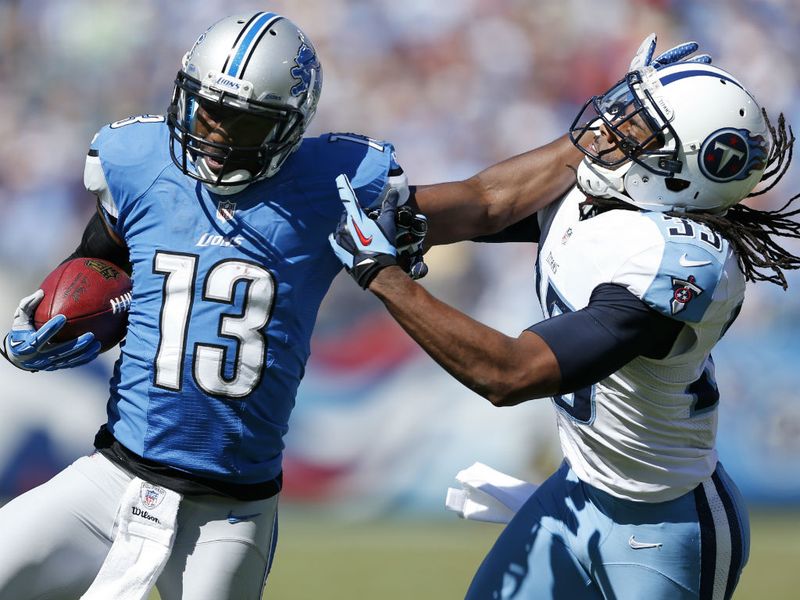 Nate Burleson (L) caught a touchdown pass but could not stop the Lions from slipping to 1-2