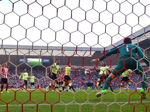 Demba Ba deflects the ball into his own net