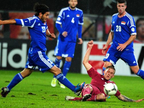 Vladimirs Kamess slides in for a tackle
