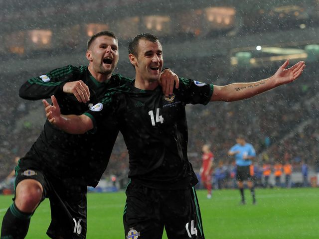 Niall McGinn celebrates his goal