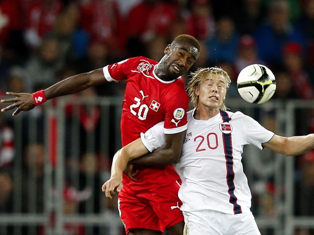 Djourou and Soderlund go up for a header.