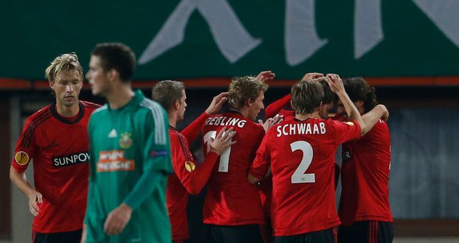 Philipp Wollscheid is mobbed after giving Leverkusen the lead