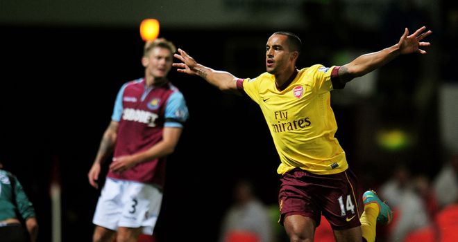 Theo Walcott: Warned by Arsenal chairman Peter Hill-Wood that the club won't break their wage structure to keep him