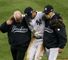 New York Yankees shortstop Derek Jeter is helped from the field with a broken ankle