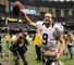 Drew Brees broke an NFL record by throwing a touchdown pass in 48 straight games as the New Orleans Saints beat the San Diego Chargers 31-24.
