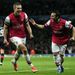 Lukas Podolski finds the net as Arsenal go back in front against the Greek outfit