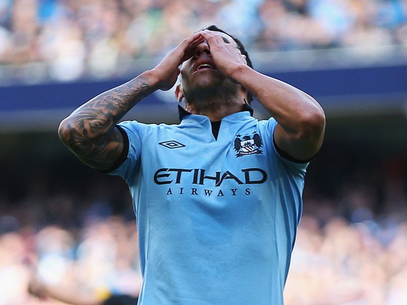 Carlos Tevez reacts after nearly doubling Manchester City's lead in the first half.