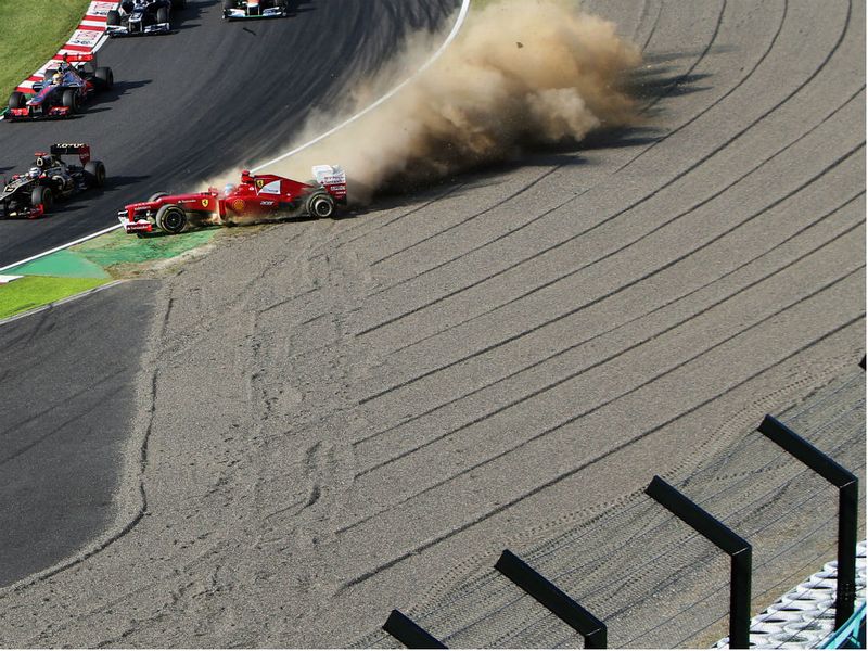 Fernando Alonso spins into the gravel