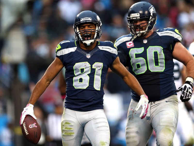 Golden Tate celebrates his touchdown as Seattle battle past Carolina.