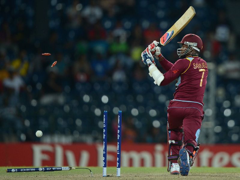 Marlon Samuels was bowled by Pat Cummins for 26.