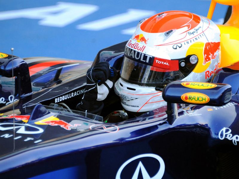 The race winner arrives back in parc ferme