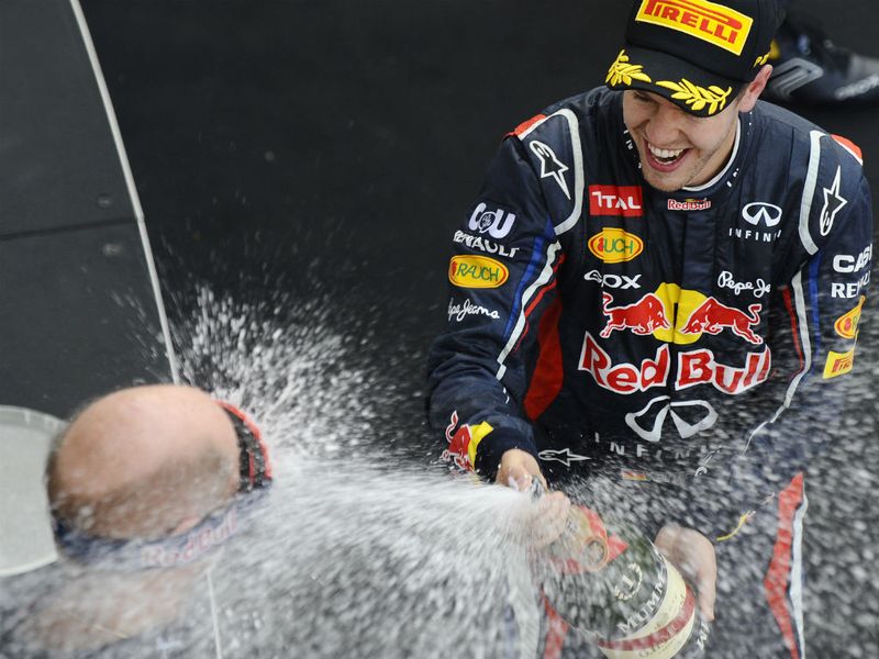Adrian Newey gets soaked - luckily he brough goggles