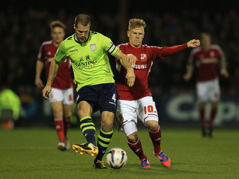 Ron Vlaar and Matt Ritchie do battle at the County Ground.