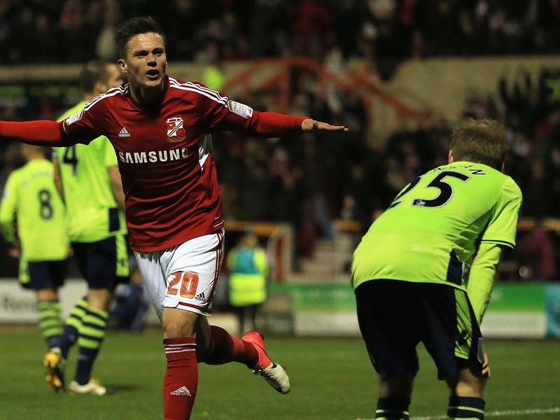 Swindon haul themselves back into it as substitute Miles Storey nets the second of a late brace.