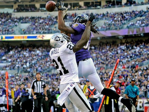 Torrey Smith catches a touchdown pass for Baltimore