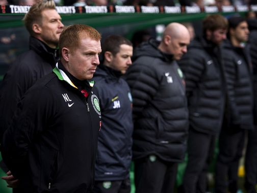 Neil Lennon stands silent before the game