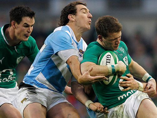 Gilroy is tackled by Santiago Fernandez.