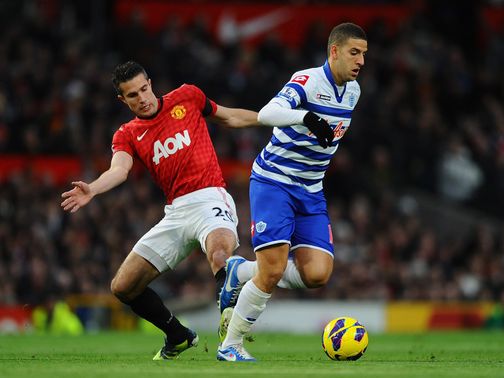 Robin van Persie and Adel Taarabt battle for the ball