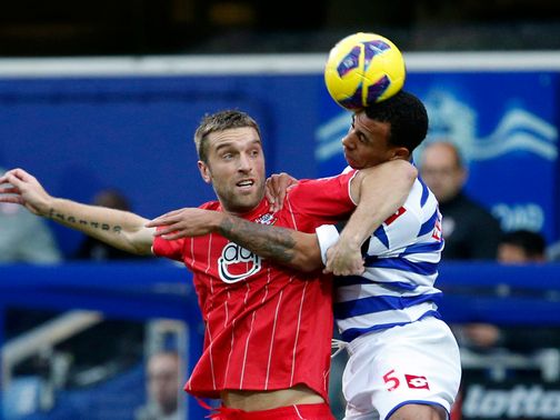 Rickie Lambert and Anton Ferdinand battle for the ball