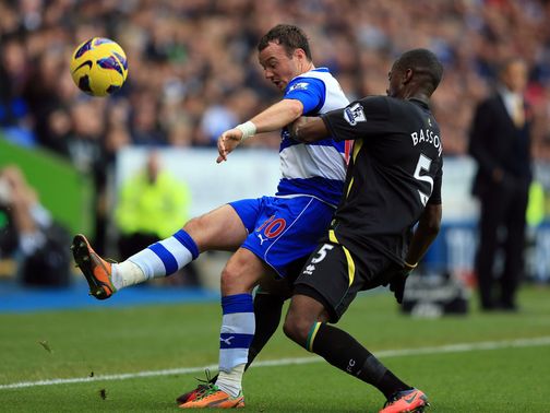 Noel Hunt and Sebastien Bassong battle for the ball