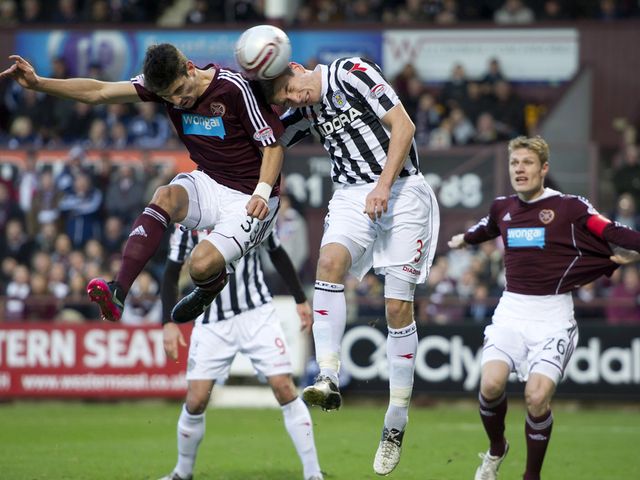 Paul Dummett wins the aerial battle with Callum Paterson