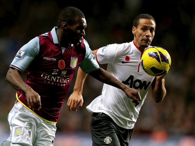 Christian Benteke and Rio Ferdinand battle for the ball