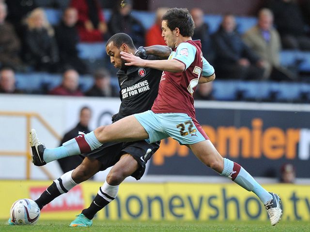 Brian Stock tries to block a Danny Haynes cross