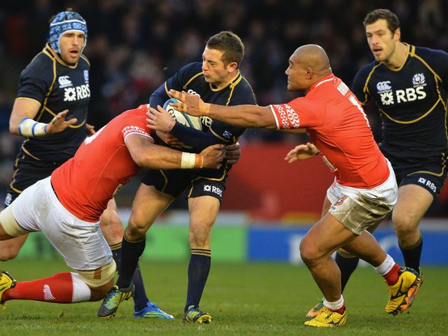 Greig Laidlaw is tackled.