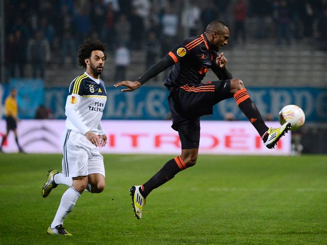 Mark Cristian and Abdallah Kassim battle for the ball