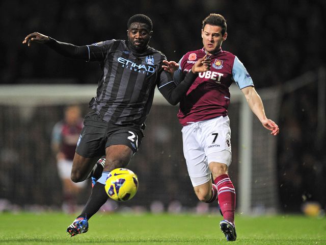 Kolo Toure and Matt Jarvis battle for the ball