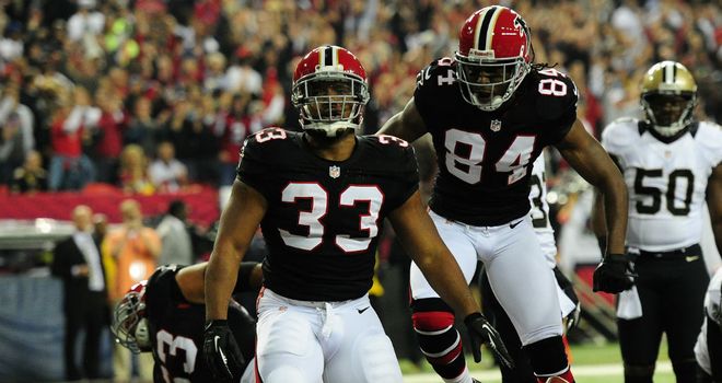 Micheal Turner celebrates his touchdown