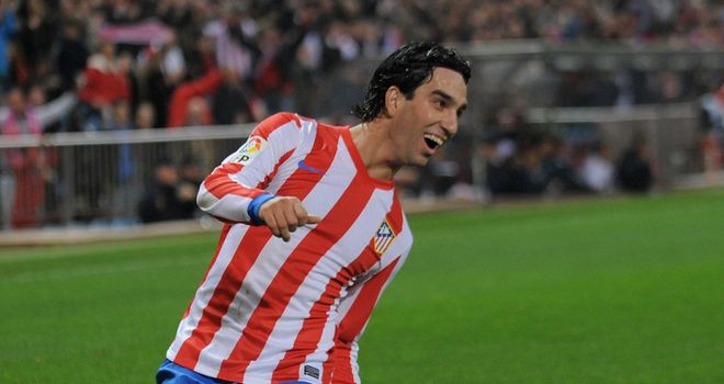 Arda Turan celebrates as Atletico take charge