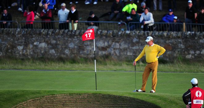 Miguel Angel Jimenez inspects the famous bunker at the 17th