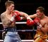 Ricky Hatton (left) trades blows with Vyacheslav Senchenko