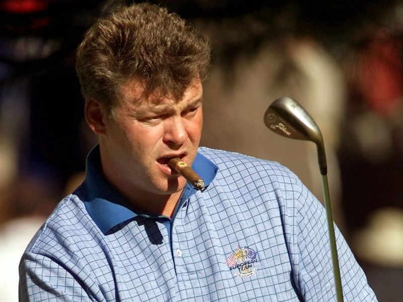 Clarke is known for his love of cigars, even at a practice round before the 1999 Ryder Cup at Brookline.